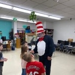 The Cat visiting with first graders