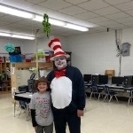 The Cat in the Hat posing with students