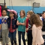 Second graders listening to the Cat sing